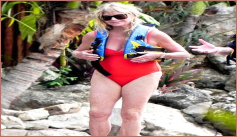 Goldie Hawn Rocks a Red Swimsuit at Age 67, Feeds Dolphins With Kurt Russell